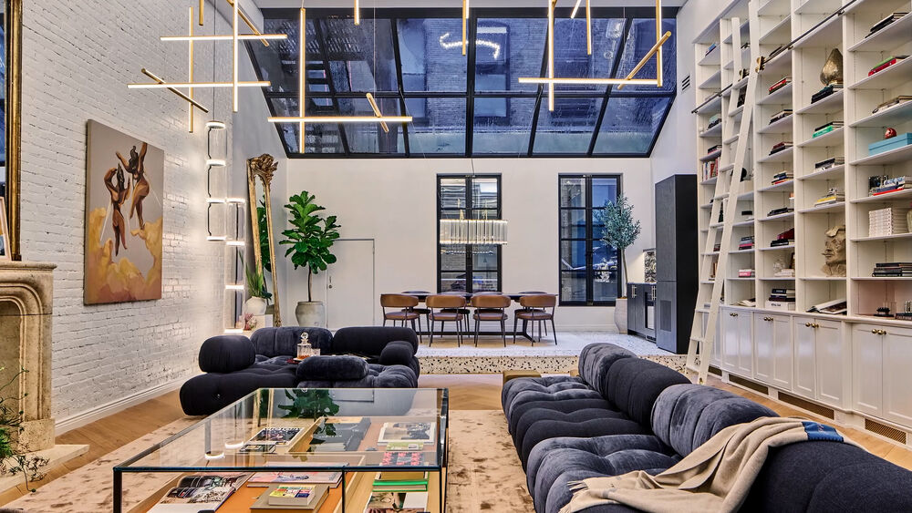 Contemporary Noho loft of Hannah and Brendan with B&B Italia modular seating and open industrial design