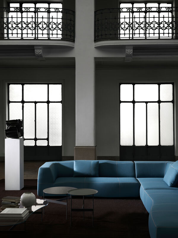 Camaleonda white valvet sofa in a black setting